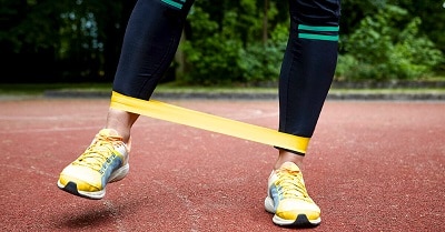 Woman Stretching Resistance Band